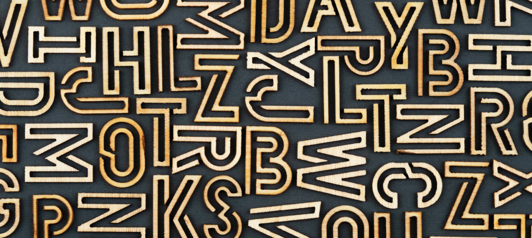 Gold letters on a black background, used to comment on AEO and the "alphabet soup" of marketing trends